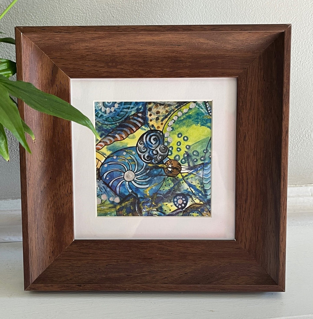 Framed artwork with a colorful abstract design on a white background