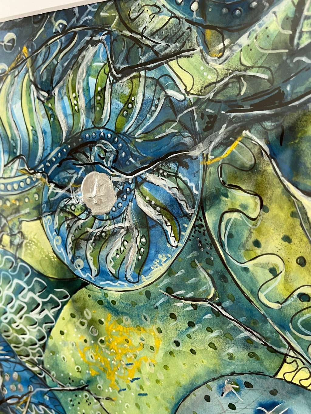 Colorful abstract artwork with swirling patterns in blue, green, and yellow.
